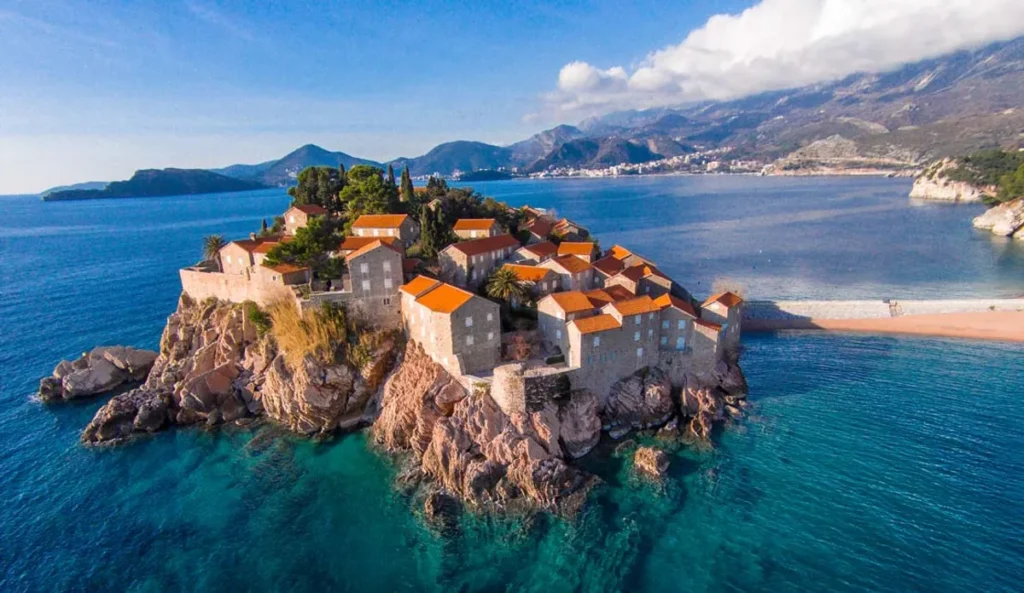 Montenegro is so rich in diverse attractions that it’s tempting to make a long list of places and set out to see them all at once. Vacations are made for pleasure, and it's even more enjoyable to allow yourself to fully indulge in the best experiences. Don't forget to purchase an eSim from Simfinity in advance—the most affordable mobile internet for roaming, which will make your trip even more exciting. Here and now, we've prepared the most "delicious" experiences just for you: 1. Adriatic Sea Beaches For those who love spending perfect moments, the wide beaches of Becici and the stunning Adriatic Sea are ideal. This spot is not far from the larger town of Budva. The sea here is incredibly clean, though somewhat cool, which is more of a plus given that temperatures can sometimes reach +35 degrees. And what could be better in such weather than a refreshing dip in the sea, surrounded by magnificent mountains? Life here bustles early in the morning, at noon, and especially in the evening. After sunset, the coast comes alive with noise, fun, street vendors, carousels—everything you’d expect from a popular tourist destination. 2. Old Town of Kotor The Old Town of Kotor is a place where you can immerse yourself in the medieval atmosphere, leisurely stroll through its narrow streets, climb the fortress walls, and walk above the rooftops, explore old churches, get closer to the St. John Fortress, and after a busy day, enjoy a meal at an outdoor restaurant. This is the most popular and atmospheric old town in Montenegro, and it will leave you breathless. 3. Ostrog Monastery Ostrog is an amazing place for people of any faith. The monastery is carved into a cliff about a kilometer high and is often shrouded in clouds. It is very beautiful, and the surrounding landscapes of mountains and valleys simply breathe peace and tranquility. 4. Blue Cave The water in this cave glows with a soft blue light, as if special lighting has been installed, but in fact, it's all natural. This magical effect is created by sunlight reflecting off the cave walls in the crystal-clear water. Swimming here is an unforgettable experience! You can visit the cave as part of a tour of the Bay of Kotor, on an excursion boat (departing from the beaches of Miriste and Zanjice), or by renting a boat at these same beaches. 5. Porto Montenegro Marina One evening, we recommend you visit Tivat and take a stroll along the incredibly beautiful Porto Montenegro waterfront. There are many luxury yachts, greenery, and fountains. Cafes and restaurants offer views of the bay. In the evening, the waterfront is beautifully lit, with no loud music or large crowds—a very pleasant place for walking and relaxing by the sea. Share the beauty with your loved ones, thanks to eSim Simfinity. 6. Black Lake Black Lake is rightfully one of the most popular lakes in Montenegro. The locals call it the “Mountain Eyes.” The view of the lake will leave you in awe. In good weather, it’s especially beautiful: the turquoise water gradually shifts to a dark blue, there’s plenty of greenery, and above the forest—mountains. You can take a walk around the lake, ride a boat, or simply sit on benches by the shore. The photos you’ll take here will be perfect for your social media feed, and Simfinity will help you share them with ease. You won’t regret visiting! 7. Djurdjevica Tara Bridge This huge arch bridge spans the deepest canyon in Europe. It is 365 meters long and 172 meters high. For landscape lovers and those looking to take amazing panoramic photos, this is a must-visit place. The scenery is stunning: surrounded by mountain ranges, with the Tara River roaring below, where fearless rafters navigate the rapids. Thrill-seekers can even zipline across the canyon. If you're hesitating whether to try it or not—definitely go for it! 8. Rijeka Crnojevica This small, fairytale town is a paradise for photographers. The old stone bridge, built in 1853 for trade caravans heading to Virpazar, still impresses today. You can walk across it to reach the other side of the river, where you’ll get an interesting view of the town. On the waterfront, you’ll be offered a boat trip on Skadar Lake. You can also sit in a café with a view of the bridge and enjoy a leisurely breakfast. 9. Negusi Village Negusi Village definitely belongs on the list of Montenegro’s must-see attractions, as this is where authentic Montenegrin prosciutto is made according to traditional recipes. It’s not a factory production; every piece of meat is prepared by hand. Imagine: first, the pork hams are salted for two weeks, then placed under a press for several more weeks, and finally smoked for six months to a year. All this time, the master monitors the optimal temperature, checks the meat, and maintains the right level of smokiness in the smokehouse by burning beech or oak chips. The craft is challenging, but the result is worth all the effort. The prosciutto turns out exquisite. You can taste and buy this delicacy in almost every yard in the village. The prosciutto is sold both in whole pieces and sliced, packaged on the spot in vacuum-sealed portions according to your needs. Montenegro has many surprises in store for its guests, so don't forget to visit. And with Simfinity’s international eSim, stay connected wherever you are without huge roaming bills and without any hassle.